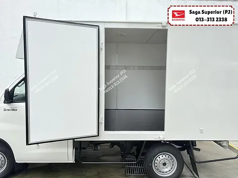 Daihatsu Gran Max luton van with kerbside cargo door open showing the box interior